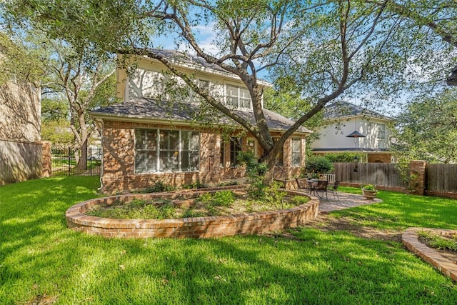 7815 Moritz Ln, Austin, TX 78731 - rear view of property featuring a patio and brick siding