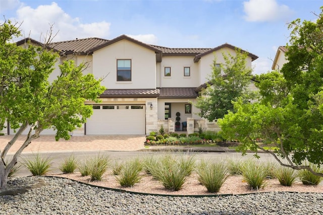 303 Marina View Ct Unit 23A, Austin, TX 78734 - view of front of property with stucco siding, a tiled roof, a garage, and driveway