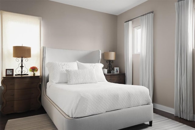 303 Marina View Ct Unit 23A, Austin, TX 78734 - bedroom featuring baseboards and wood finished floors