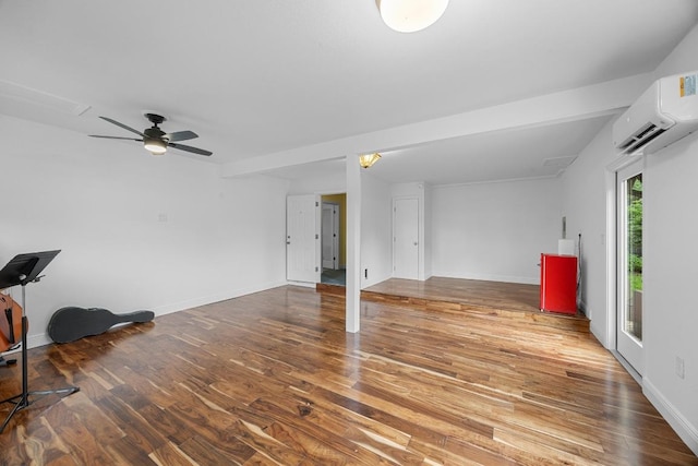 1209 Clearfield Dr, Austin, TX 78758 - unfurnished living room featuring a wall mounted air conditioner, wood finished floors, and ceiling fan