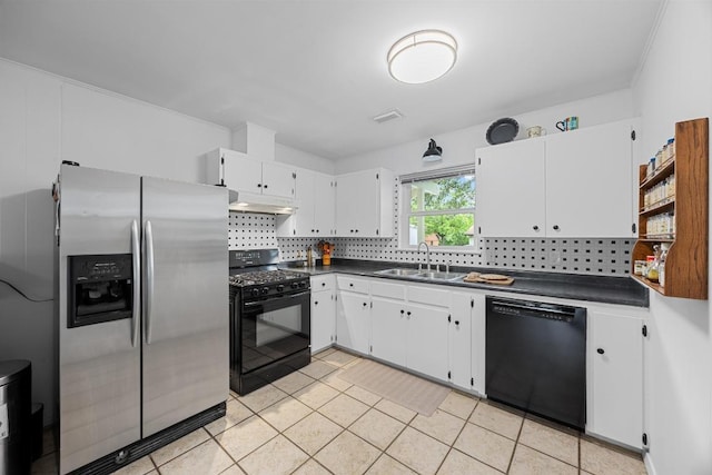 1209 Clearfield Dr, Austin, TX 78758 - kitchen featuring black appliances, dark countertops, under cabinet range hood, tasteful backsplash, and white cabinetry
