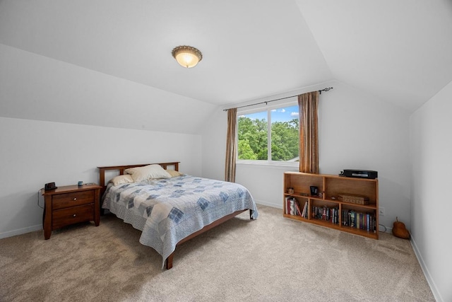 1209 Clearfield Dr, Austin, TX 78758 - carpeted bedroom featuring vaulted ceiling and baseboards
