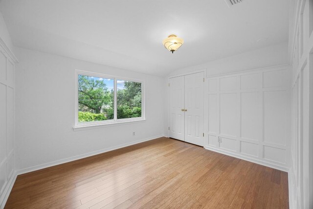 1209 Clearfield Dr, Austin, TX 78758 - unfurnished bedroom with light wood finished floors and baseboards
