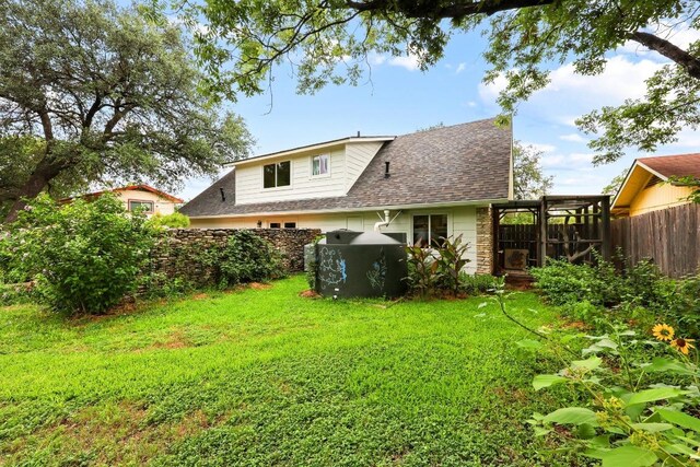 1209 Clearfield Dr, Austin, TX 78758 - rear view of house featuring roof with shingles and stone siding
