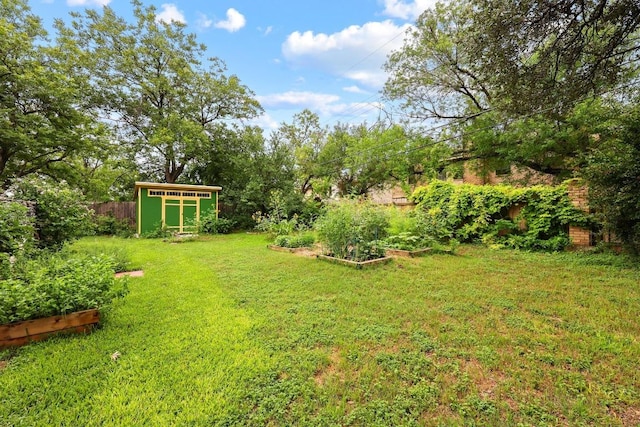 1209 Clearfield Dr, Austin, TX 78758 - view of yard featuring a storage shed and a garden