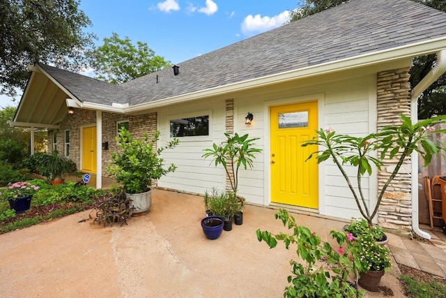 1209 Clearfield Dr, Austin, TX 78758 - property entrance with roof with shingles