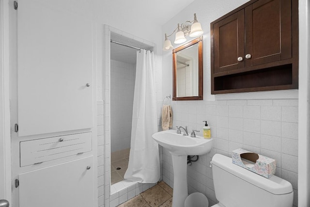 1209 Clearfield Dr, Austin, TX 78758 - full bathroom with a shower stall, tile patterned floors, decorative backsplash, and tile walls
