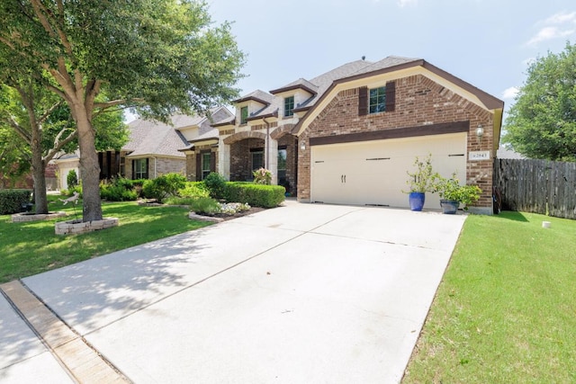 2843 Nolina Ln, Round Rock, TX 78681 - view of front facade featuring brick siding and driveway