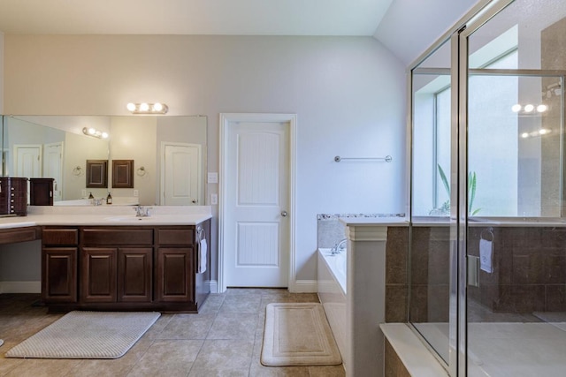 2843 Nolina Ln, Round Rock, TX 78681 - bathroom featuring vanity, a garden tub, a shower stall, tile patterned flooring, and vaulted ceiling