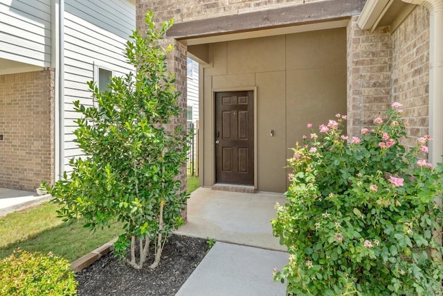 225 Lambert St, Leander, TX 78641 - property entrance featuring brick siding