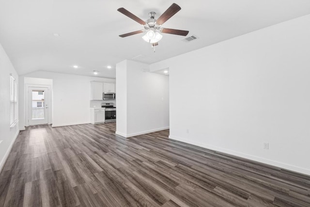 225 Lambert St, Leander, TX 78641 - unfurnished living room with dark wood-type flooring, a ceiling fan, recessed lighting, and vaulted ceiling