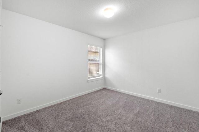 225 Lambert St, Leander, TX 78641 - carpeted spare room with baseboards