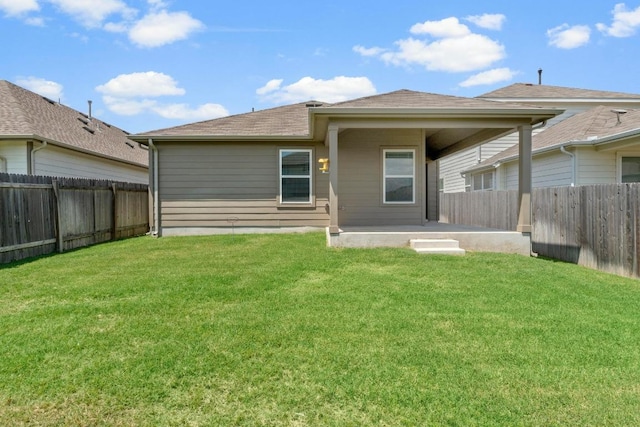 225 Lambert St, Leander, TX 78641 - back of property with a fenced backyard, a patio, and a shingled roof