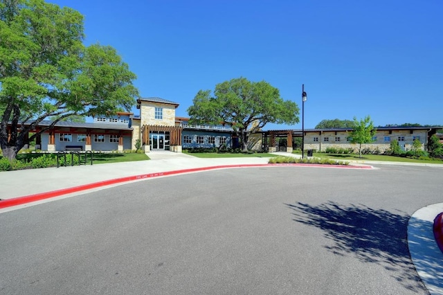 225 Lambert St, Leander, TX 78641 - view of asphalt street with sidewalks, curbs, and street lights