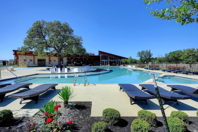 225 Lambert St, Leander, TX 78641 - community pool featuring a patio area