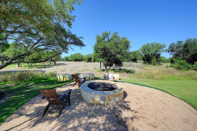 225 Lambert St, Leander, TX 78641 - view of patio / terrace with an outdoor fire pit