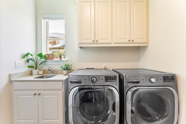 1821 Gilded Crest Dr, Leander, TX 78641 - laundry area featuring washer and clothes dryer and cabinet space
