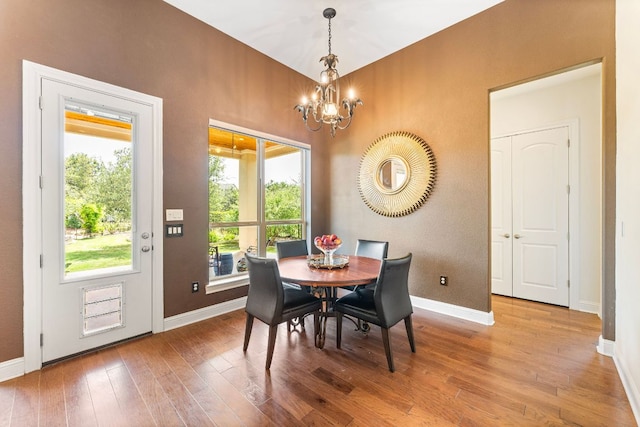 1821 Gilded Crest Dr, Leander, TX 78641 - dining room with a chandelier and wood-type flooring