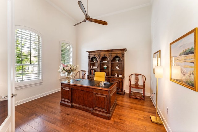 1821 Gilded Crest Dr, Leander, TX 78641 - office area with ceiling fan, dark wood-style floors, a towering ceiling, and crown molding