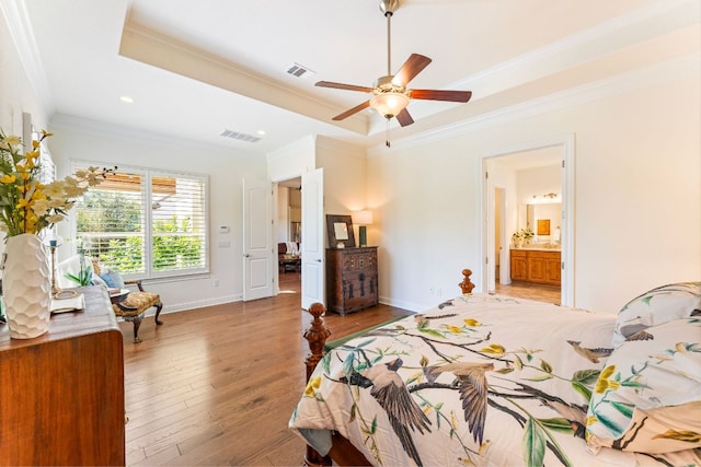 1821 Gilded Crest Dr, Leander, TX 78641 - bedroom featuring ornamental molding, a tray ceiling, light wood-style floors, recessed lighting, and ceiling fan