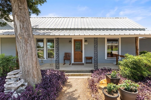 104 S 1st St, Thorndale, TX 76577 - view of front facade featuring a porch and a metal roof