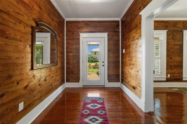 104 S 1st St, Thorndale, TX 76577 - doorway to outside featuring wood walls, hardwood / wood-style floors, and ornamental molding