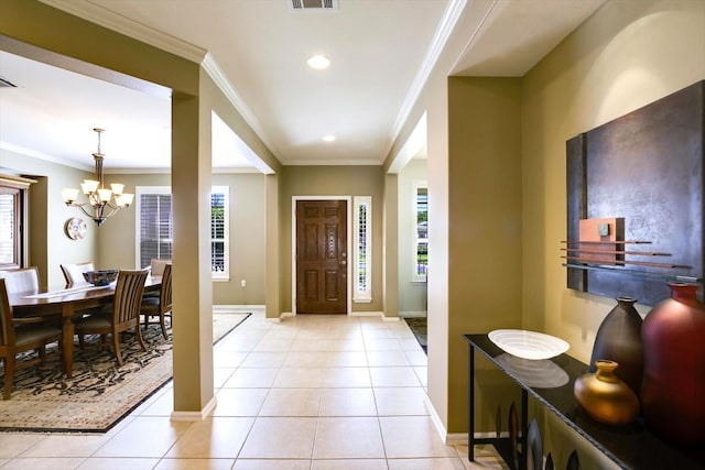 203 Mustang Island Trl, Georgetown, TX 78633 - foyer entrance with a chandelier, ornamental molding, light tile patterned floors, and recessed lighting