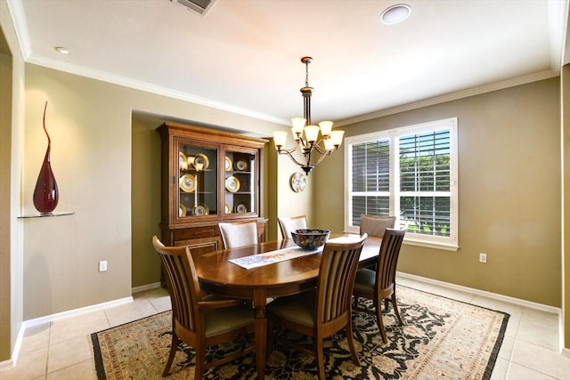 203 Mustang Island Trl, Georgetown, TX 78633 - dining space with a chandelier, light tile patterned floors, and ornamental molding