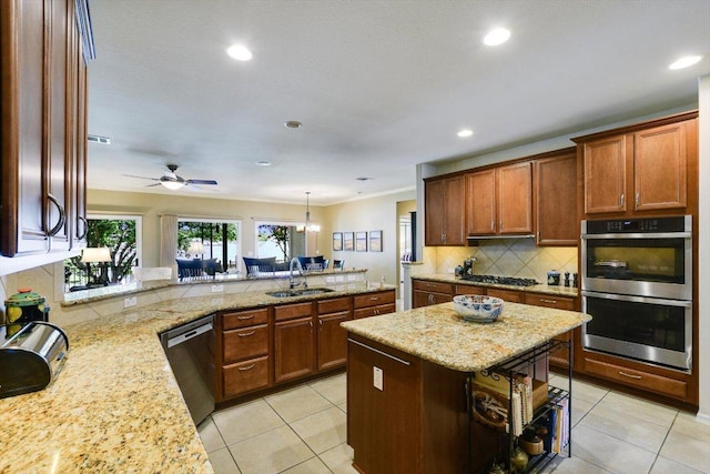 203 Mustang Island Trl, Georgetown, TX 78633 - kitchen with appliances with stainless steel finishes, backsplash, light tile patterned floors, light stone counters, and recessed lighting
