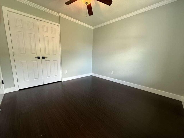 6609 Capriola Dr, Austin, TX 78745 - spare room with ceiling fan, dark wood-style flooring, and crown molding