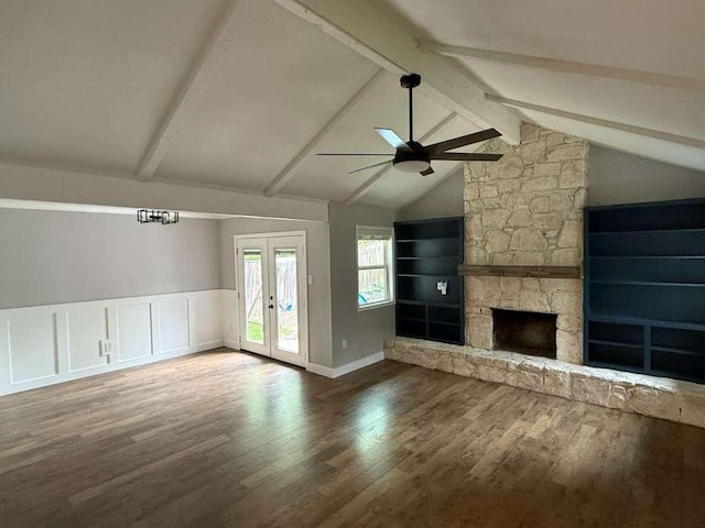 6609 Capriola Dr, Austin, TX 78745 - unfurnished living room with ceiling fan, french doors, wood finished floors, and a stone fireplace