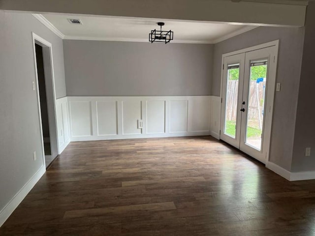 6609 Capriola Dr, Austin, TX 78745 - unfurnished dining area with ornamental molding, french doors, and wood finished floors