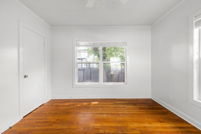 506 W 51st St Unit A, Austin, TX 78751 - unfurnished room with wood finished floors, ceiling fan, crown molding, and a textured ceiling
