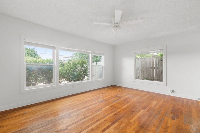 506 W 51st St Unit A, Austin, TX 78751 - spare room featuring healthy amount of natural light, a textured ceiling, light wood-style floors, and a ceiling fan