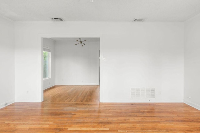 506 W 51st St Unit A, Austin, TX 78751 - spare room with light wood-style floors and baseboards