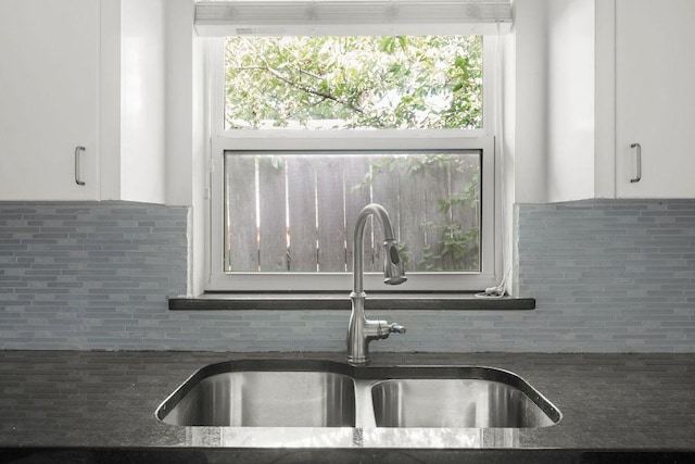 506 W 51st St Unit A, Austin, TX 78751 - kitchen featuring white cabinetry and decorative backsplash