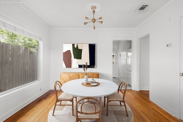 506 W 51st St Unit A, Austin, TX 78751 - dining room with wood finished floors and baseboards