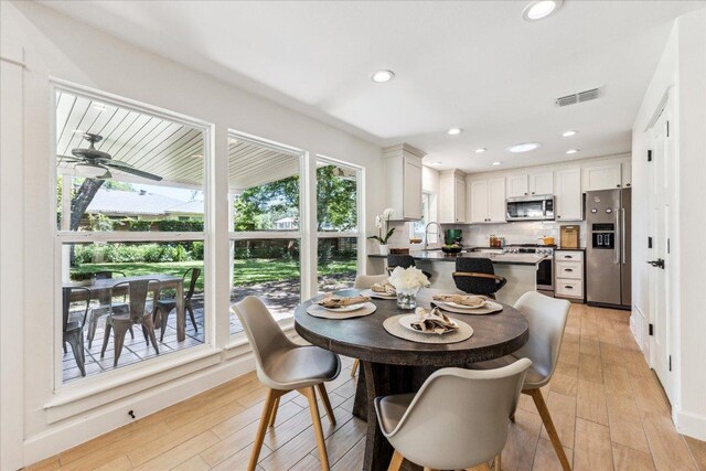 11308 Toledo Dr, Austin, TX 78759 - dining space featuring light wood finished floors and recessed lighting