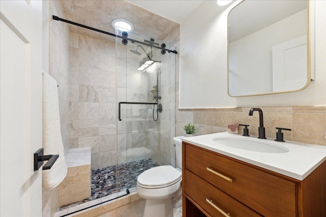 11308 Toledo Dr, Austin, TX 78759 - full bathroom with vanity, a stall shower, tile patterned floors, and tile walls