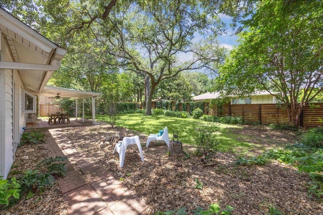 11308 Toledo Dr, Austin, TX 78759 - fenced backyard featuring ceiling fan and a patio area