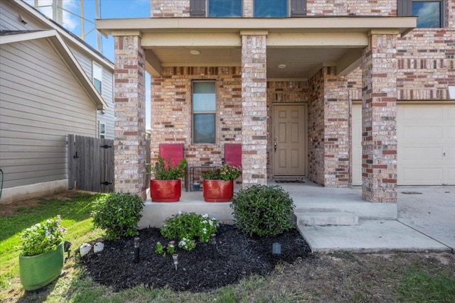 239 Crimson Ln, Kyle, TX 78640 - property entrance with brick siding and a porch