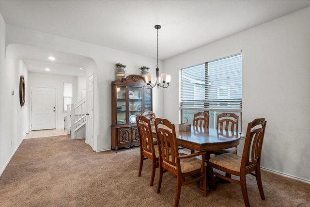 239 Crimson Ln, Kyle, TX 78640 - dining space featuring light colored carpet, a chandelier, stairs, and recessed lighting