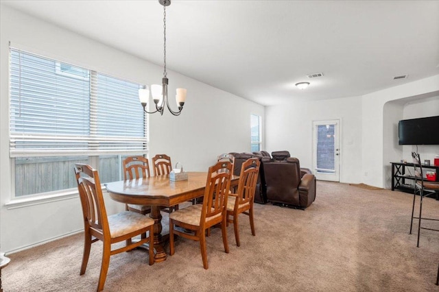 239 Crimson Ln, Kyle, TX 78640 - dining room with a chandelier and light carpet
