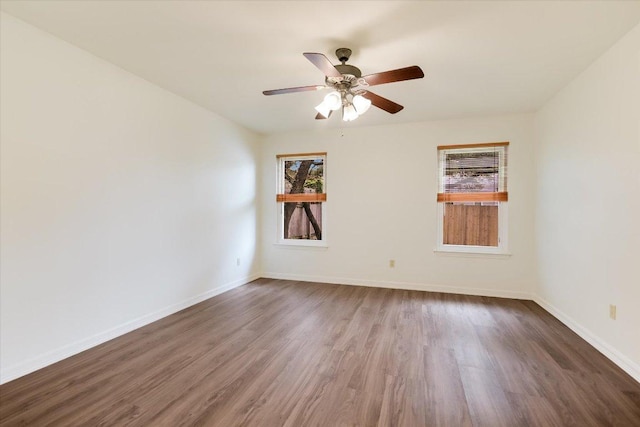 12806 Heinemann Dr, Austin, TX 78727 - empty room featuring healthy amount of natural light, dark wood-style flooring, and ceiling fan