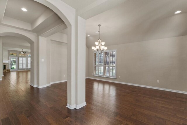 7901 Arbor Knoll Ct, Lago Vista, TX 78645 - unfurnished dining area with arched walkways, dark wood-style flooring, a chandelier, and recessed lighting