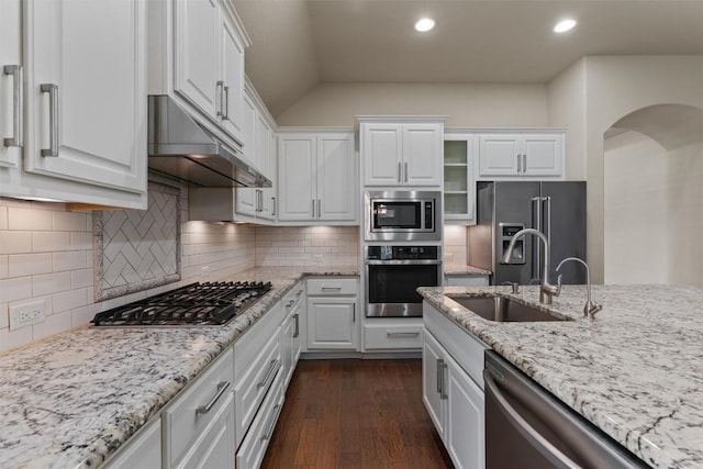 7901 Arbor Knoll Ct, Lago Vista, TX 78645 - kitchen with appliances with stainless steel finishes, white cabinetry, dark wood-style floors, light stone countertops, and recessed lighting