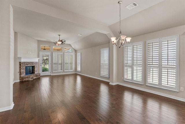 7901 Arbor Knoll Ct, Lago Vista, TX 78645 - unfurnished living room with a chandelier, lofted ceiling, hardwood / wood-style flooring, and a fireplace