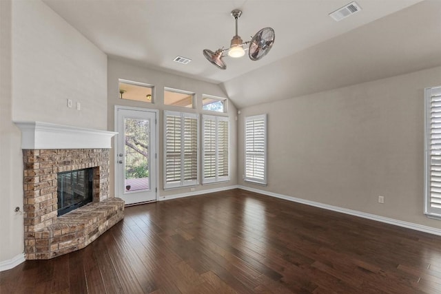 7901 Arbor Knoll Ct, Lago Vista, TX 78645 - unfurnished living room with hardwood / wood-style flooring, a fireplace, lofted ceiling, and a ceiling fan