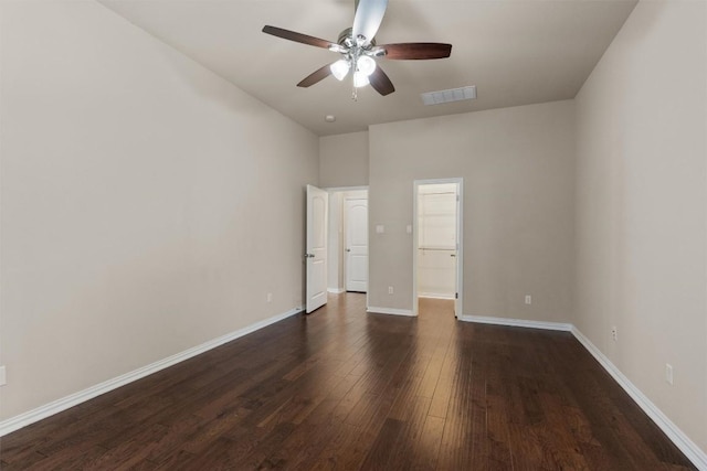 7901 Arbor Knoll Ct, Lago Vista, TX 78645 - unfurnished bedroom with dark wood-style floors, a spacious closet, ceiling fan, and a closet