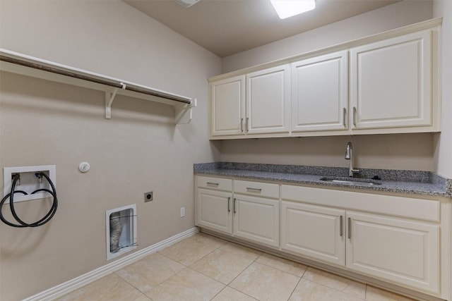 7901 Arbor Knoll Ct, Lago Vista, TX 78645 - laundry area featuring cabinet space, gas dryer hookup, light tile patterned flooring, and electric dryer hookup